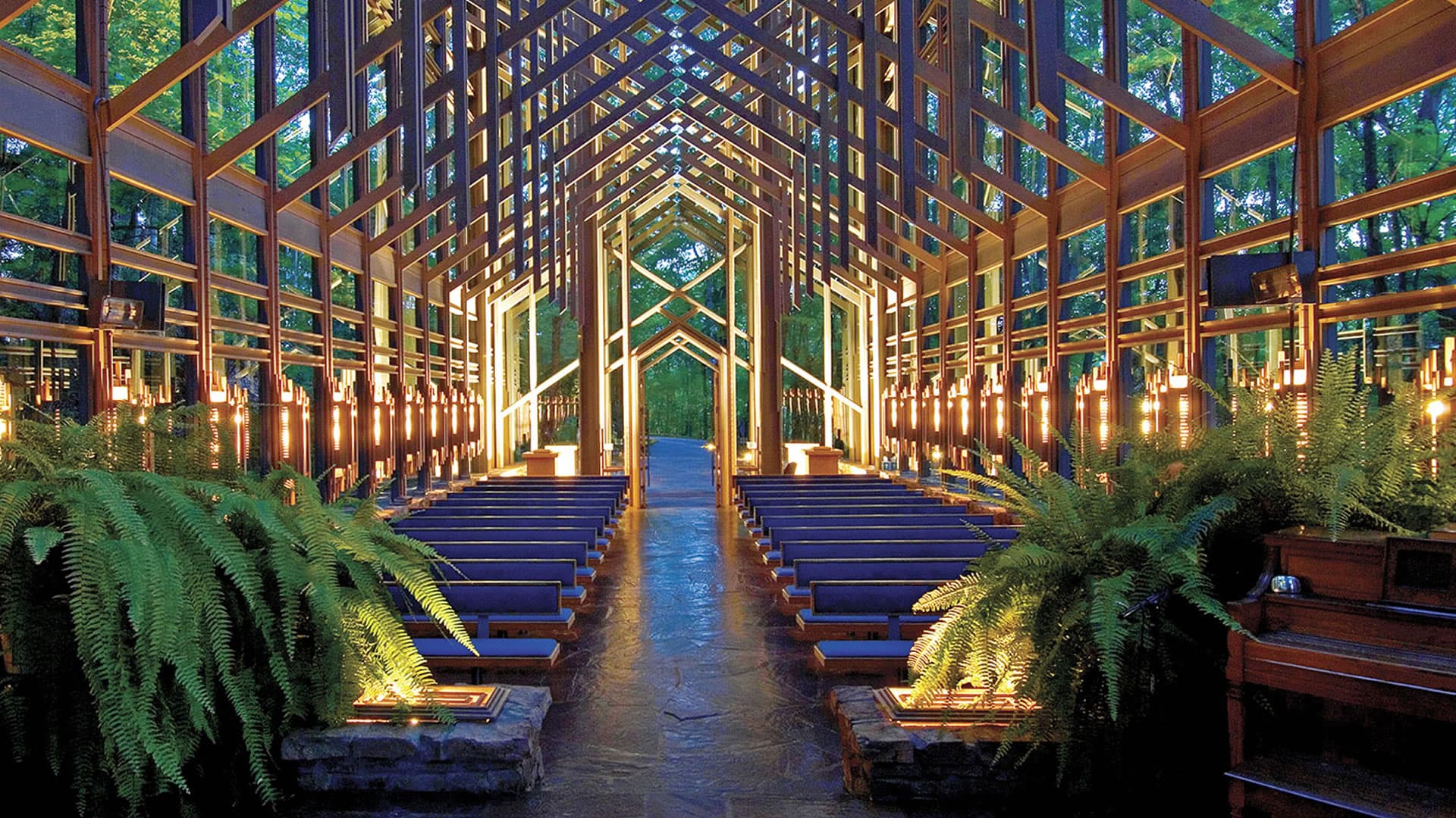 The distinctive architectural features, including the tall, wooden beams, glass walls, and natural light.